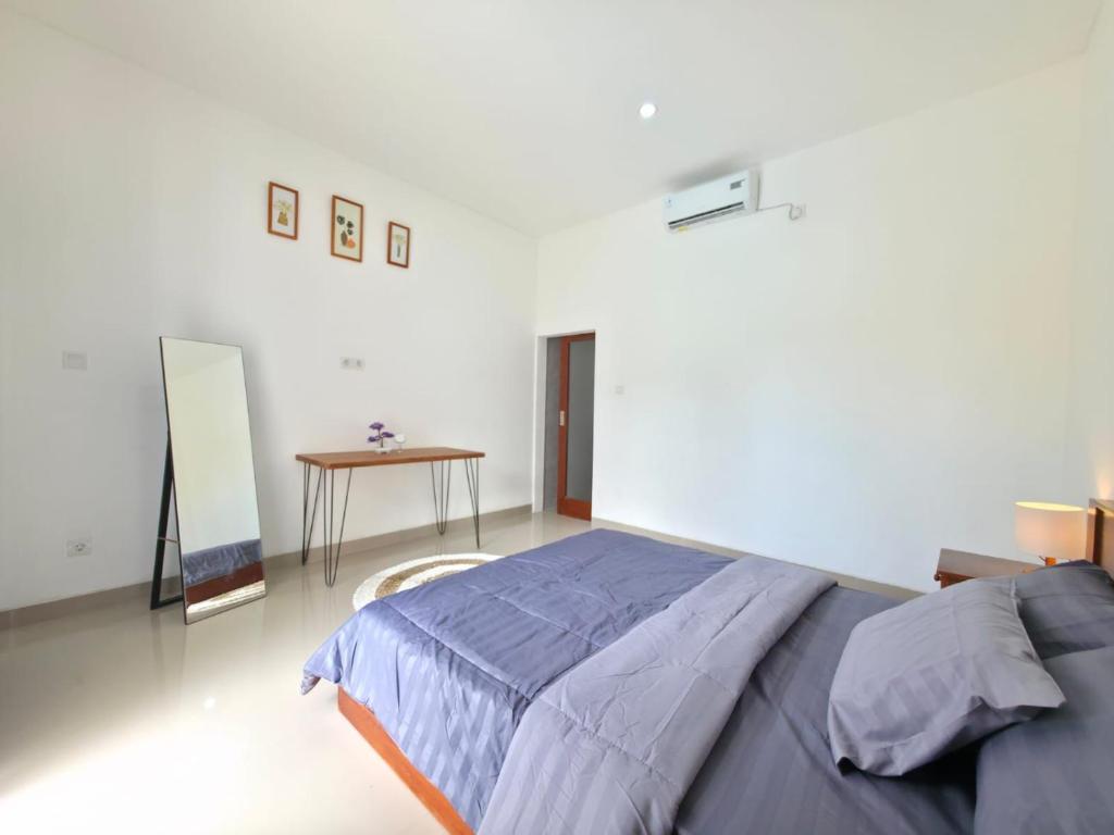 Postel nebo postele na pokoji v ubytování Villa Domino Canggu