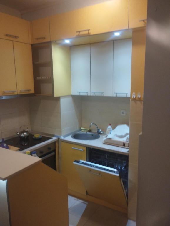 a kitchen with white cabinets and a sink at APARTMENT, PLJEVLJA, NEW BUILDING 71 m2 in Pljevlja