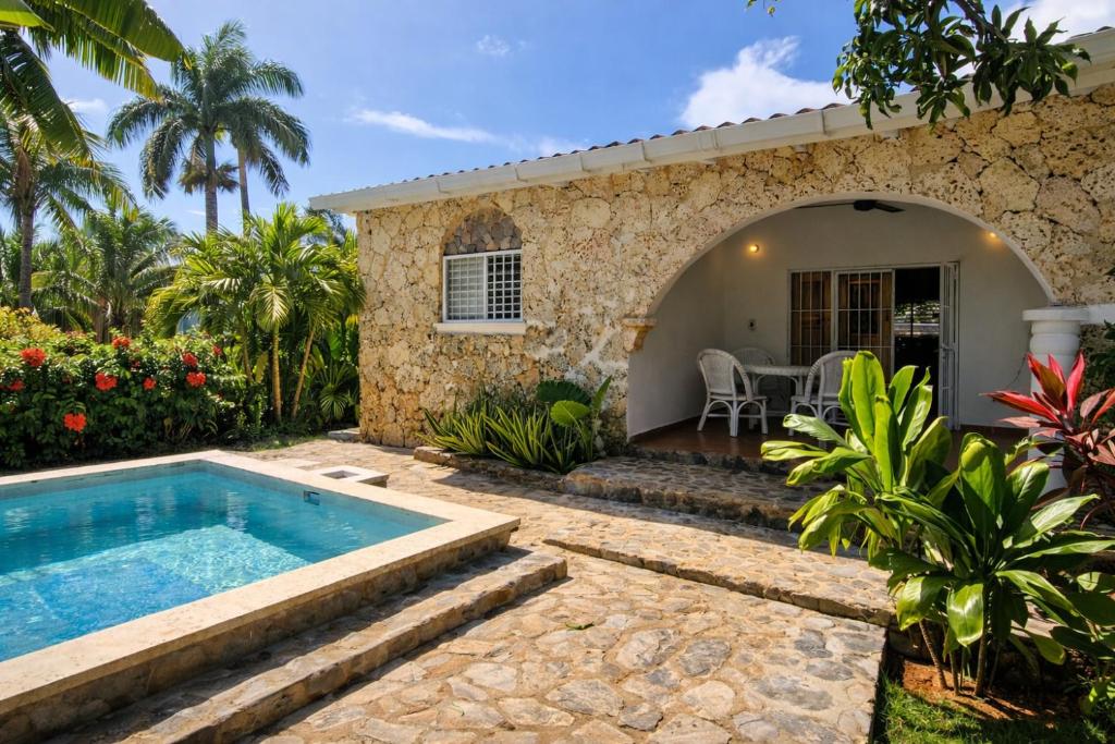 a house with a swimming pool and a patio at Casa los Mangos Private pool 150 m from the beach in Las Galeras