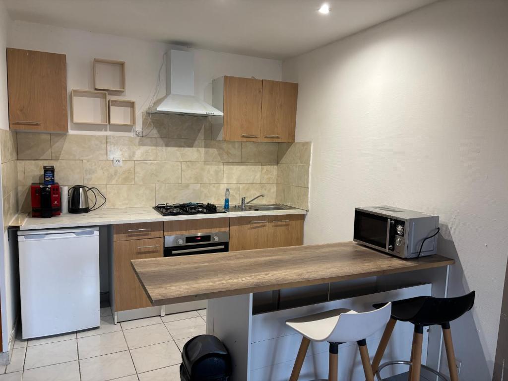 Køkken eller tekøkken på Appartement au porte de Geneve