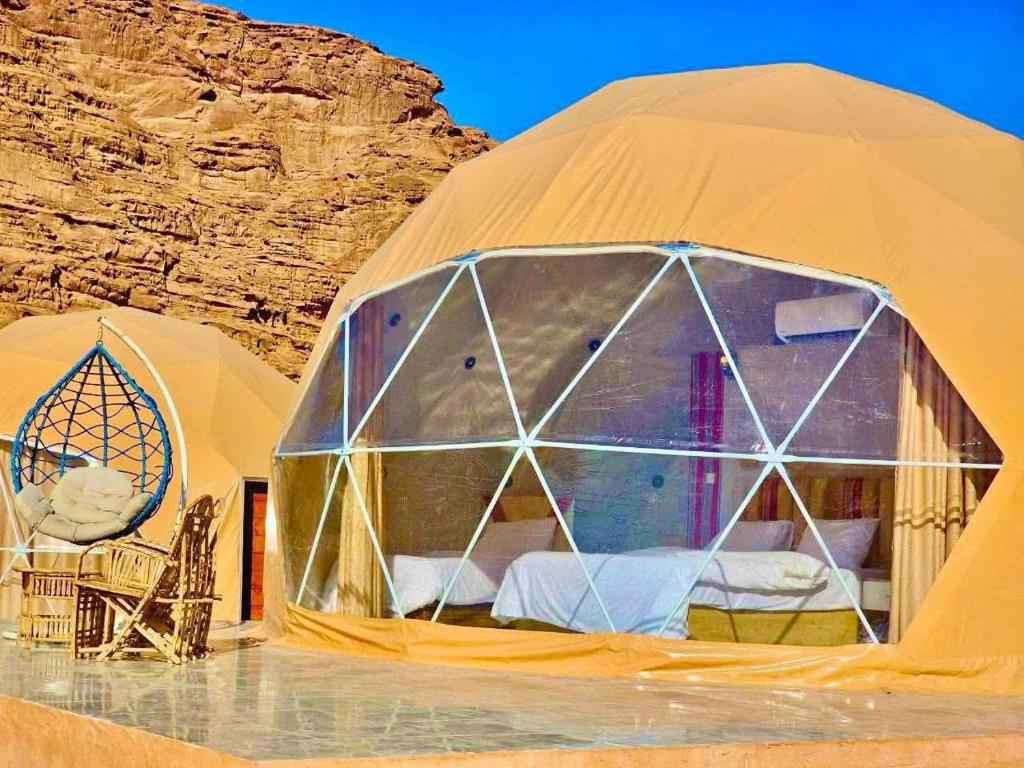 a dome tent in the middle of a desert at Ajyad Rum Camp in Wadi Rum