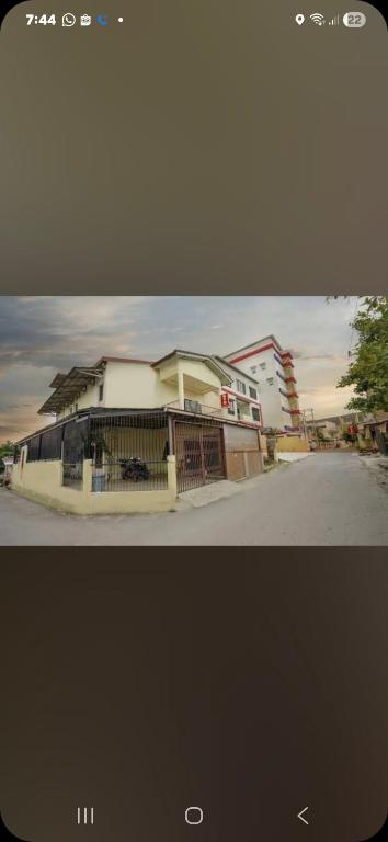 a picture of a house on the side of a street at Halim Living in Sukarami