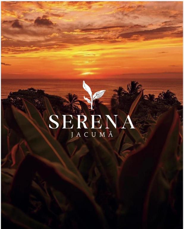 a logo for a resort with the sunset in the background at Pousada Serena Jacumã in Jacumã