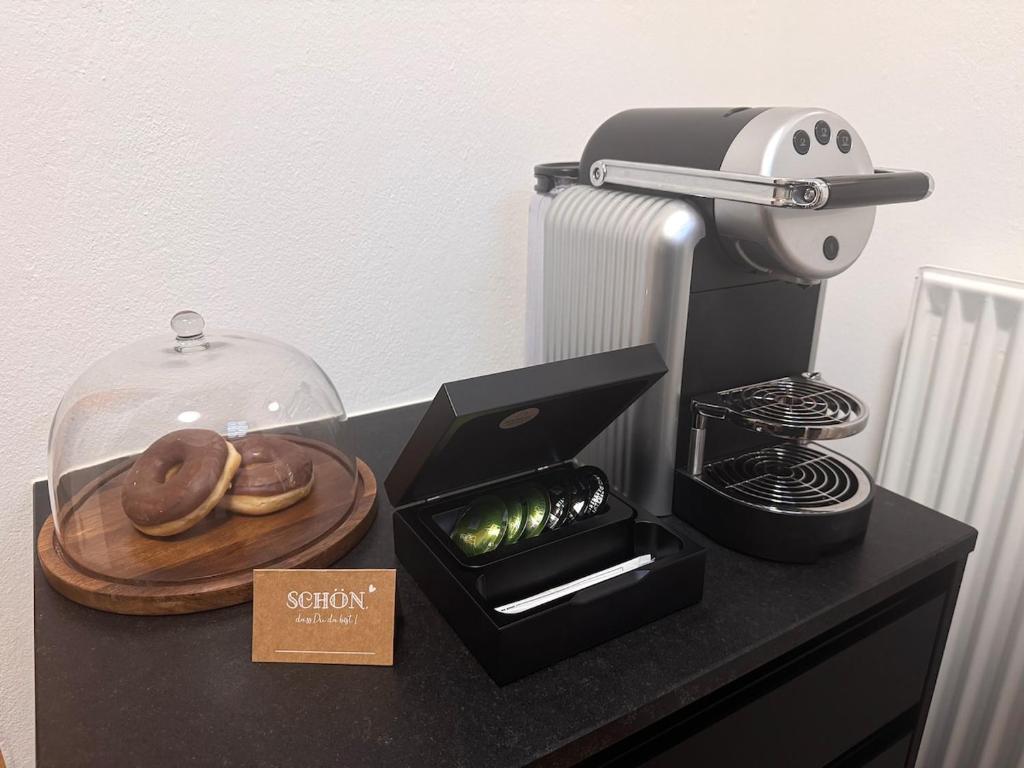 Příslušenství pro přípravu čaje a kávy v ubytování Mitten in der historischen Altstadt von Passau