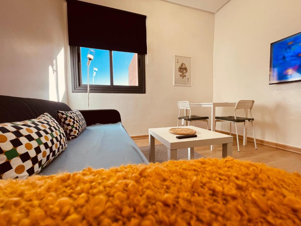 a living room with a couch and a table at ZyonFamily in Ouarzazate