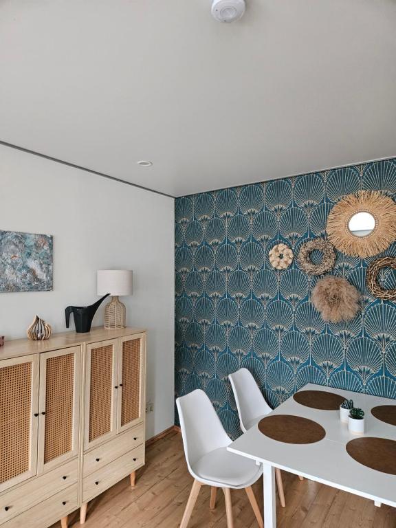 a dining room with a table and chairs at Ferienhaus An der Burg in Oschersleben