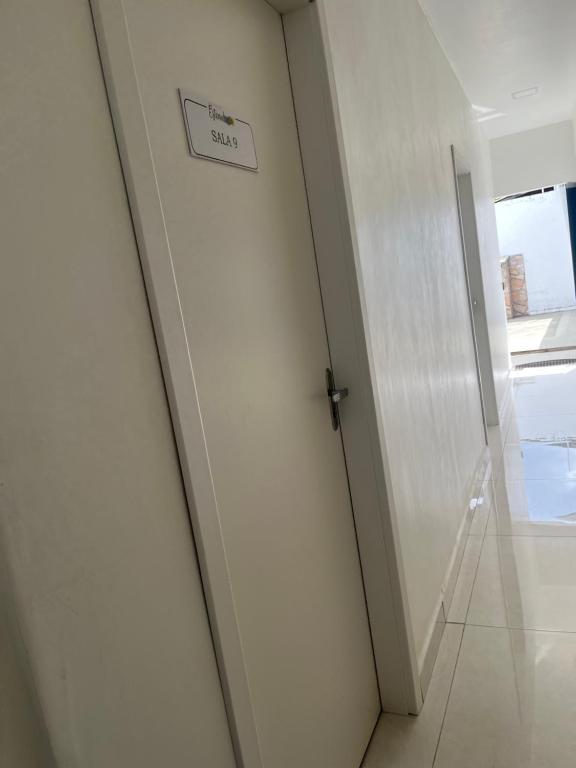 a door in a room with a sign on it at Suíte privativa in Boa Vista