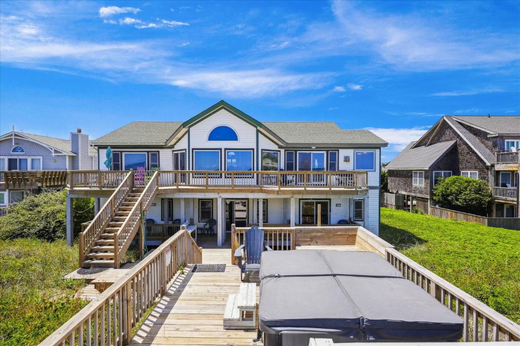 a large house with a deck and a house at SS3 - Bella Luna in Southern Shores