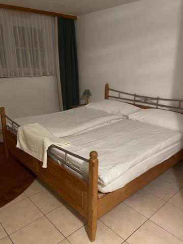 En eller flere senge i et værelse på Haus Alpenschloss