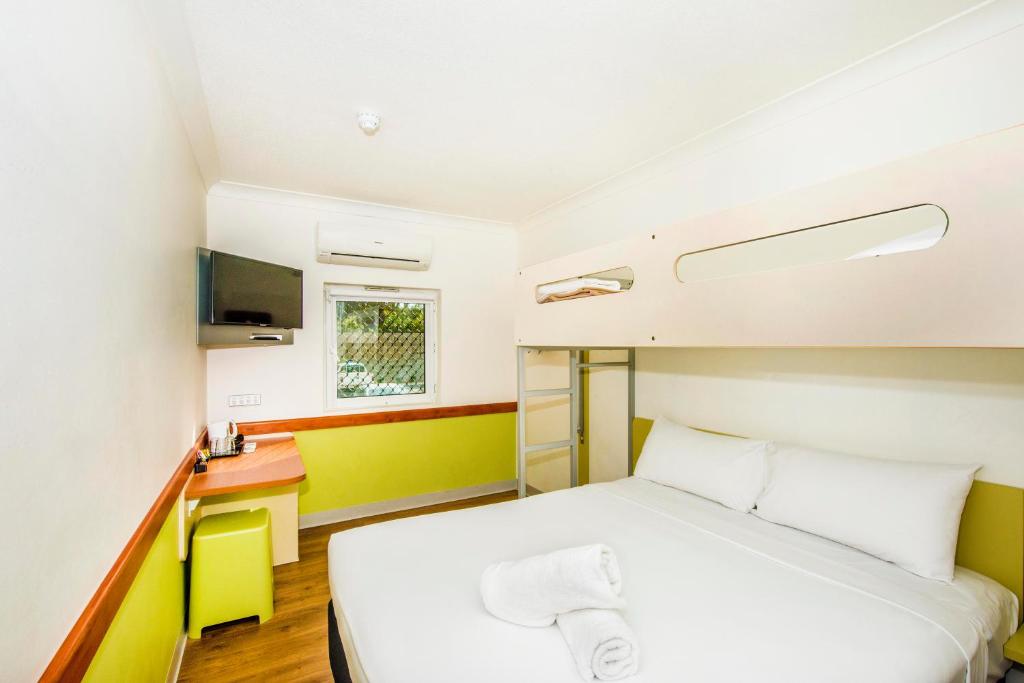 Postel nebo postele na pokoji v ubytování Imperial Motel Windsor