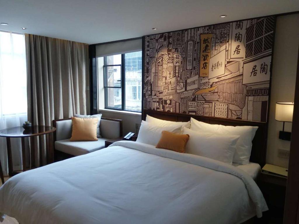 Postel nebo postele na pokoji v ubytování Guangzhou City Join Hotel Shipai Qiao metro Branch