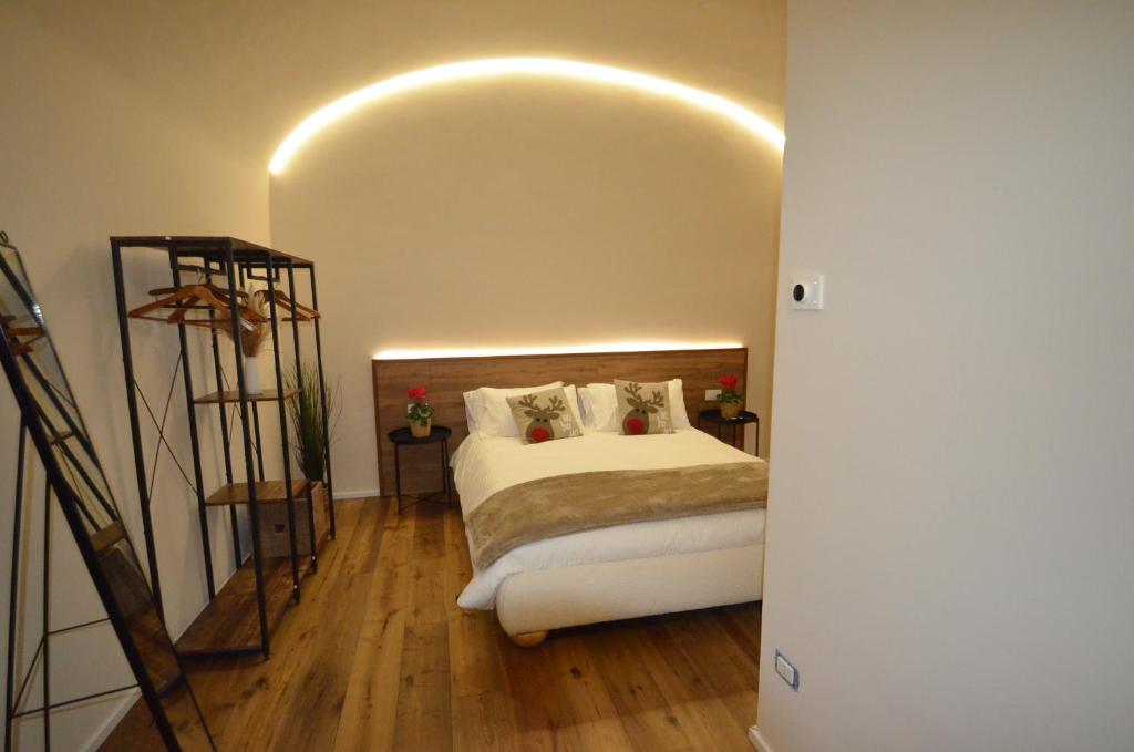 En eller flere senge i et værelse på Il Cortile del Principe