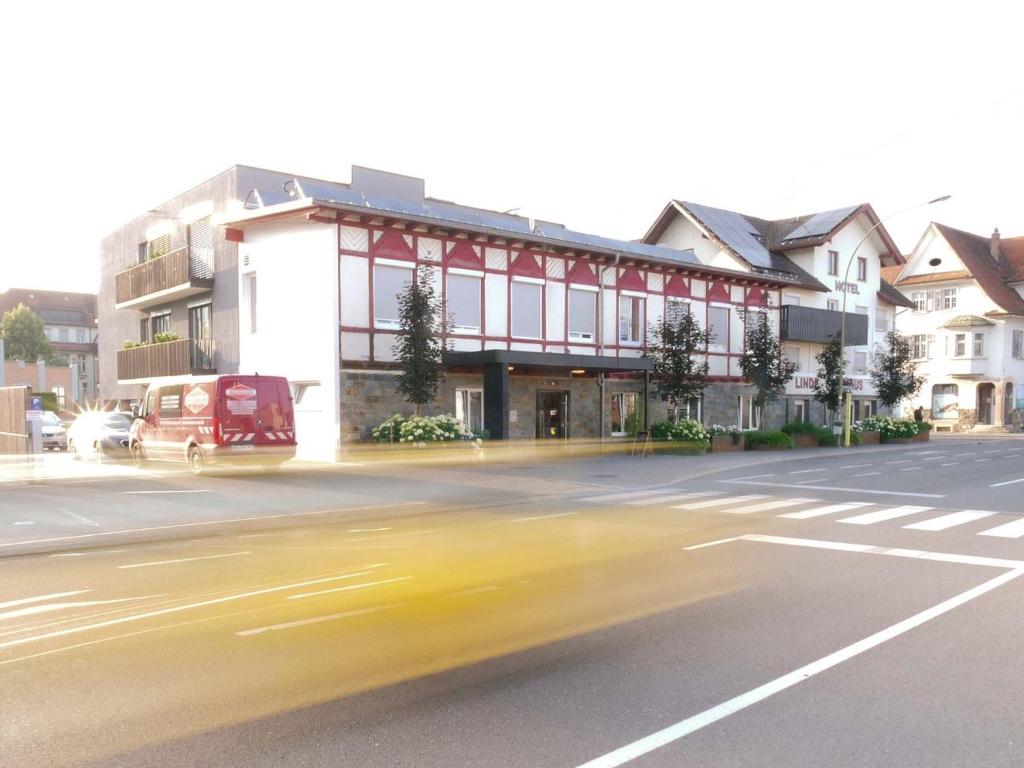 a building on the side of a city street at Hotel Linde-Sinohaus in Lustenau
