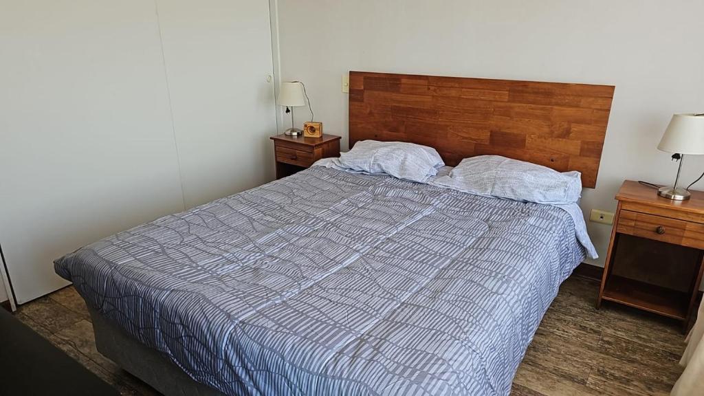 Giường trong phòng chung tại Departamento Tamarugal