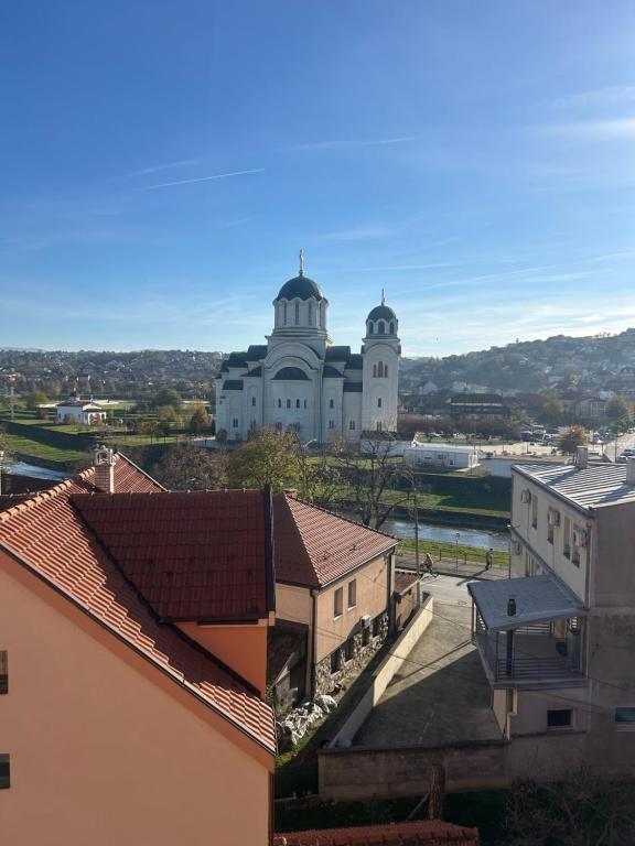 a large white building with two domes on top of it at Hram View Apartment, Valjevo Center in Valjevo