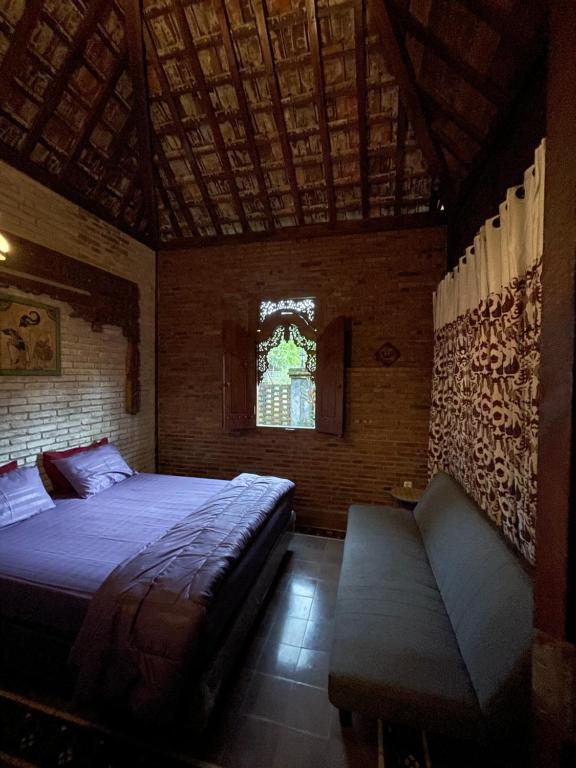 Postel nebo postele na pokoji v ubytování Merapi Farmstay