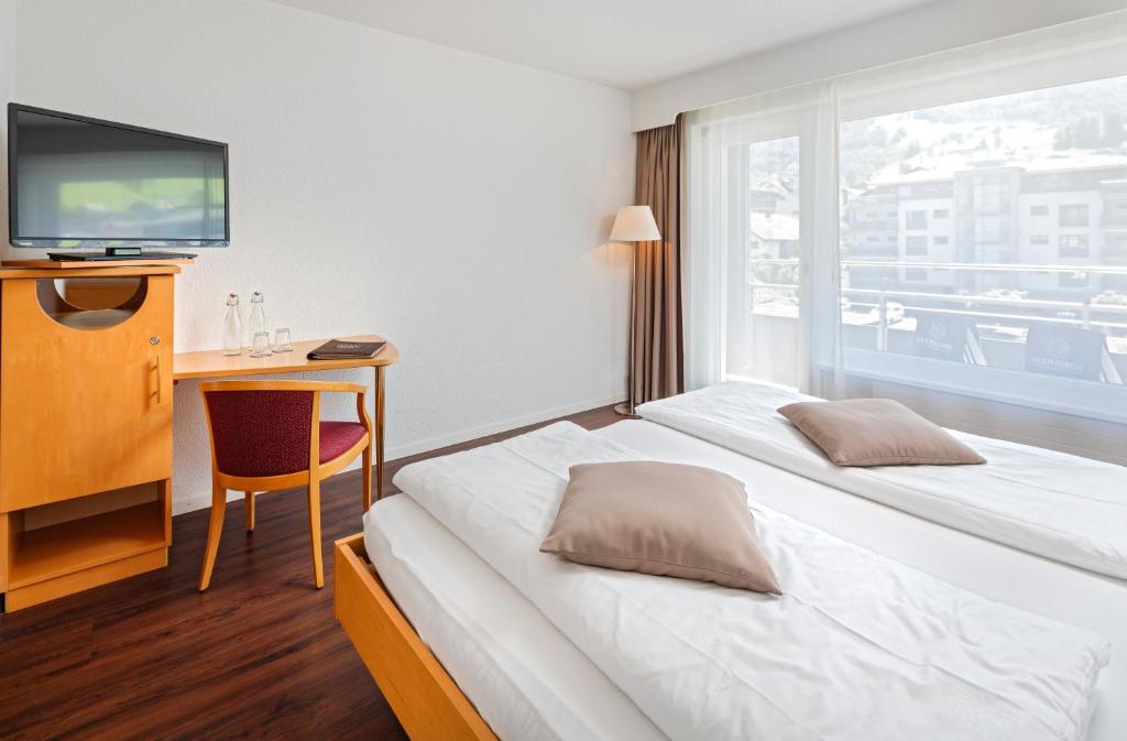 Postel nebo postele na pokoji v ubytování Seerausch Swiss Quality Hotel