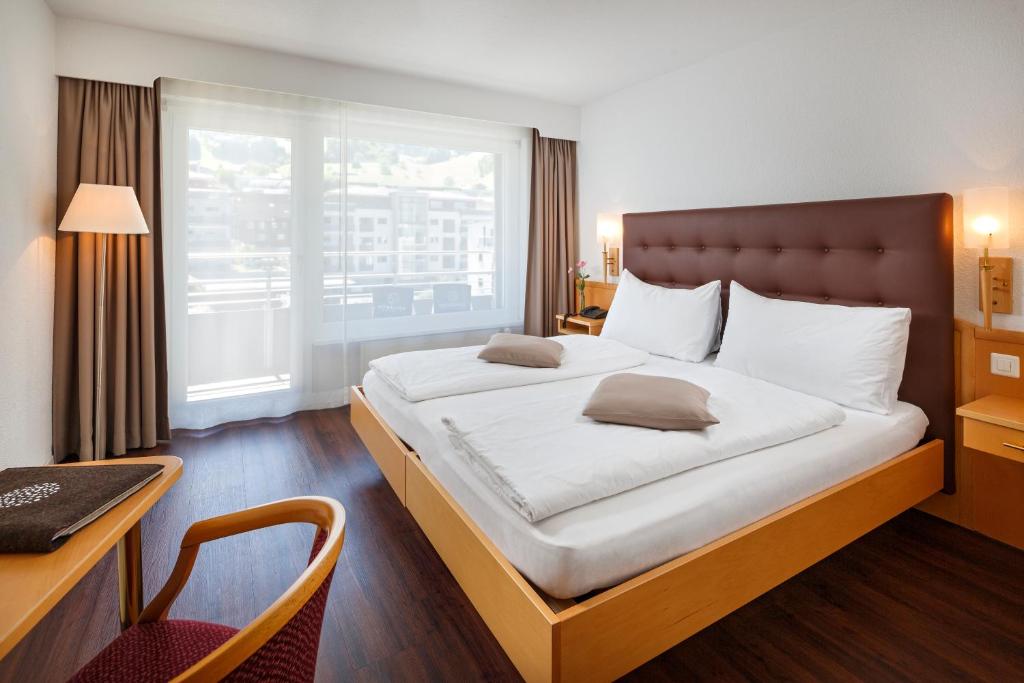 Postel nebo postele na pokoji v ubytování Seerausch Swiss Quality Hotel