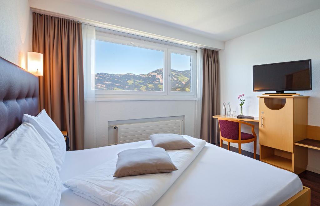 Postel nebo postele na pokoji v ubytování Seerausch Swiss Quality Hotel