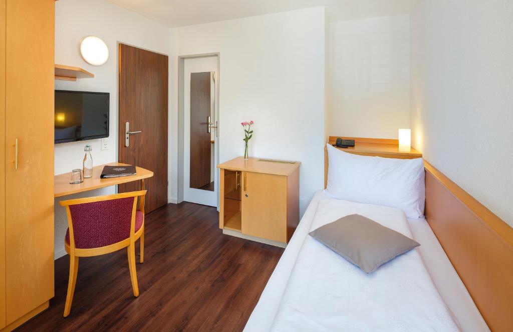 Postel nebo postele na pokoji v ubytování Seerausch Swiss Quality Hotel