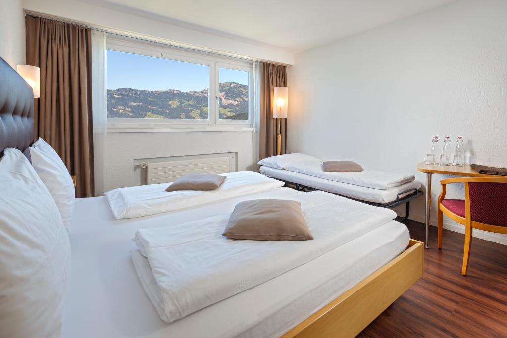Postel nebo postele na pokoji v ubytování Seerausch Swiss Quality Hotel