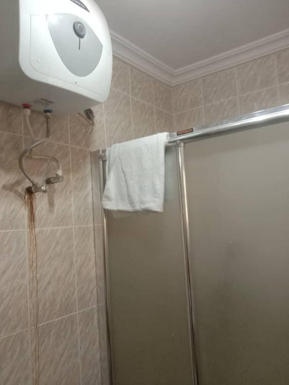 a bathroom with a shower and a shower head at MoExoticRoyaleServices in Ikorodu
