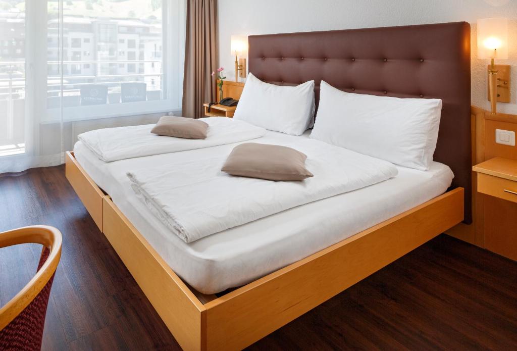 Postel nebo postele na pokoji v ubytování Seerausch Swiss Quality Hotel
