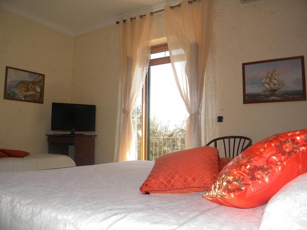 A bed or beds in a room at H.H.Le Palme