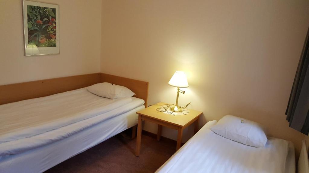 Postel nebo postele na pokoji v ubytování Hotell Sport & Rest