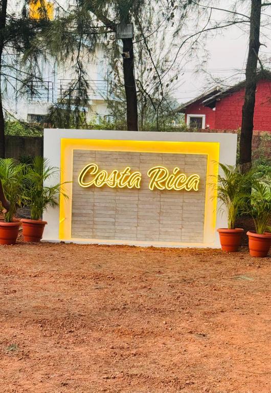 a sign that says costa rica on a garage at Costa Rica in Kumta