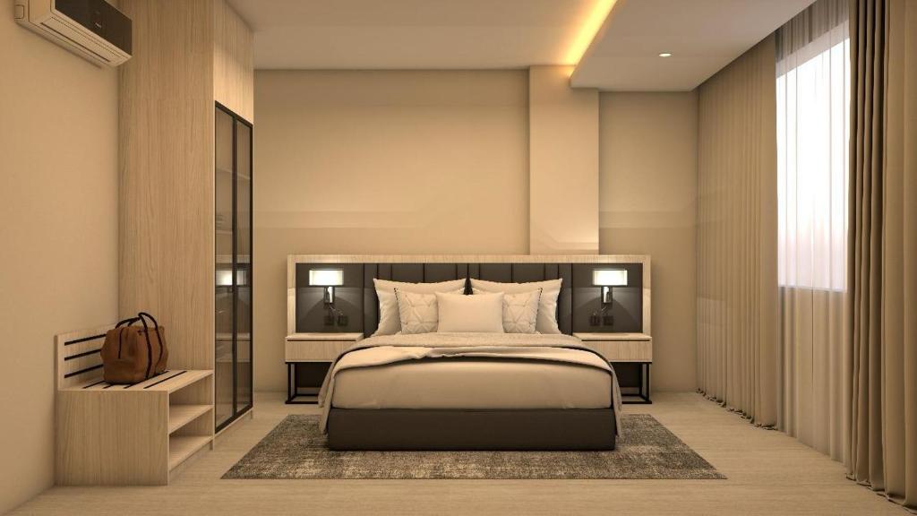 En eller flere senge i et værelse på Karim Hotel