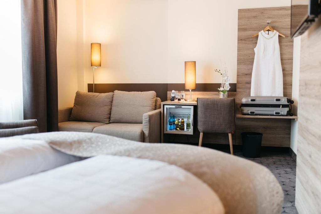Postel nebo postele na pokoji v ubytování Hotel Sion