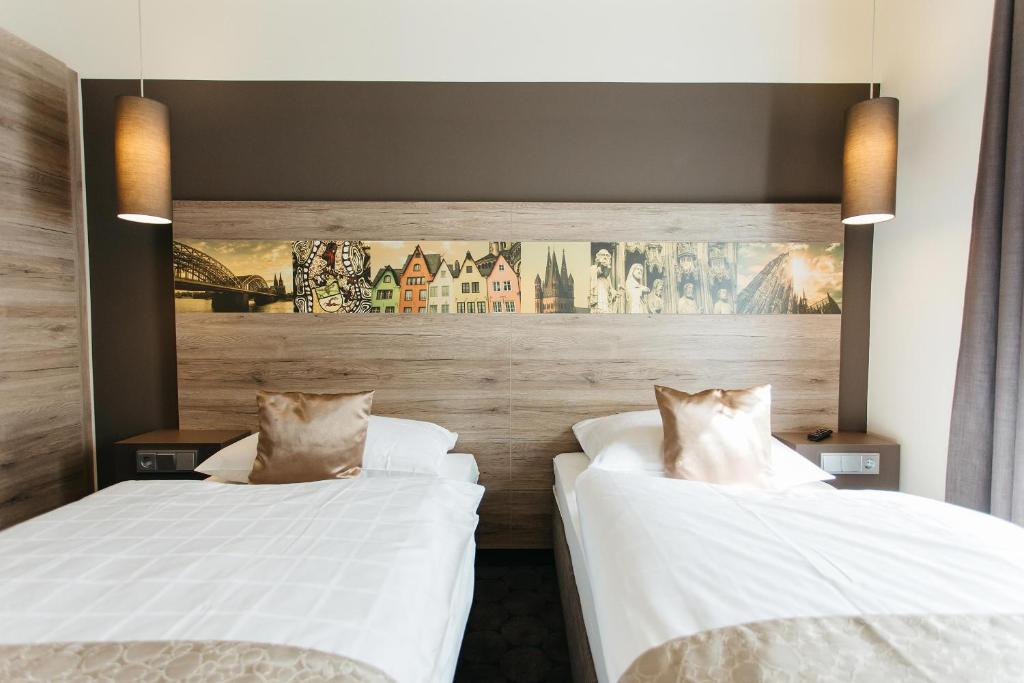 Postel nebo postele na pokoji v ubytování Hotel Sion