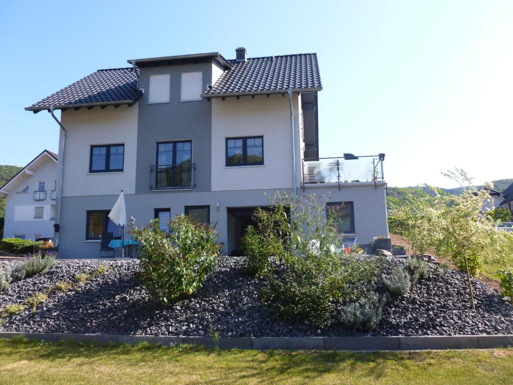 a house on a hill with a yard at Pension Susanne in Bruttig-Fankel