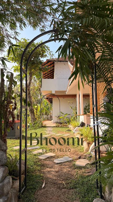 a building with a sign in front of it at Bhoomi by Ostello in Varkala
