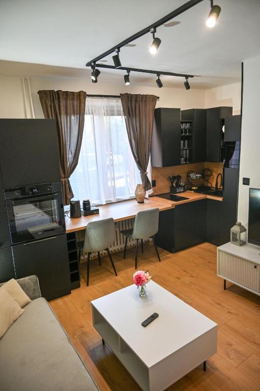 a living room with a couch and a table at Cozy Studio Heart in Banská Bystrica
