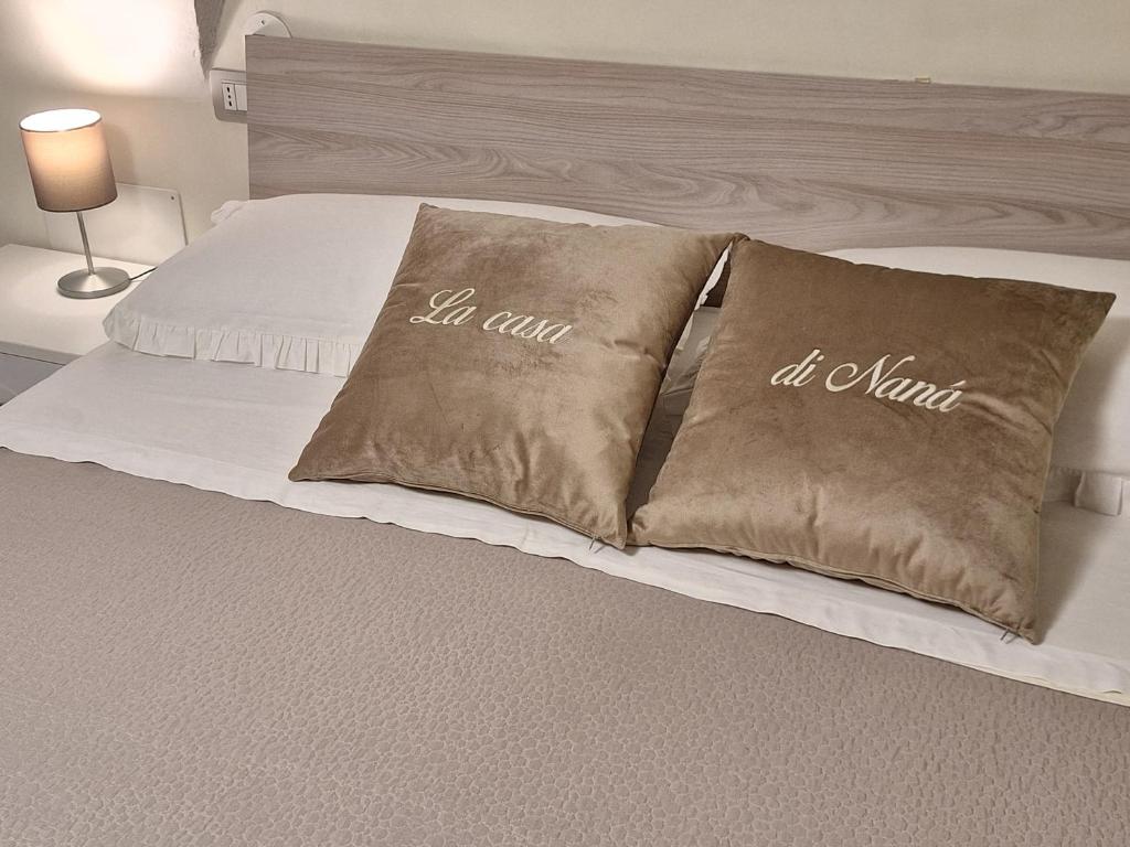 Giường trong phòng chung tại LA CASA DI NANA'