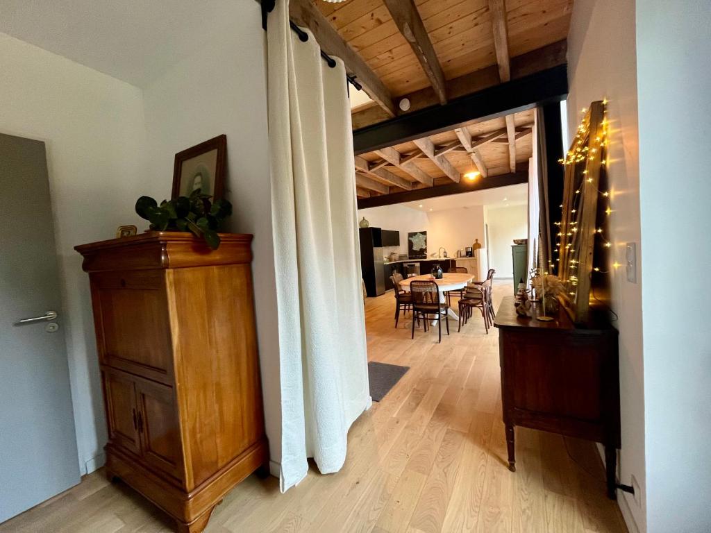 a hallway with a dining room and a living room at Bruisse in Les Iffs