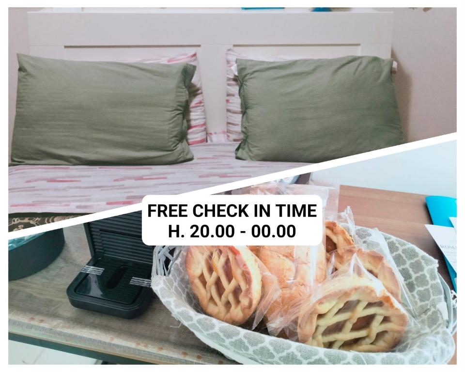 a shelf with a bed with a basket of waffles at La Perla B & B in Ciampino