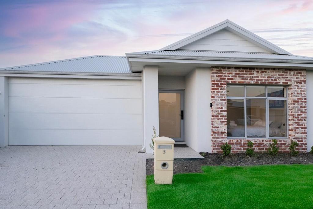 a house with a white garage at Henley Brook - Finest in Henley Brook