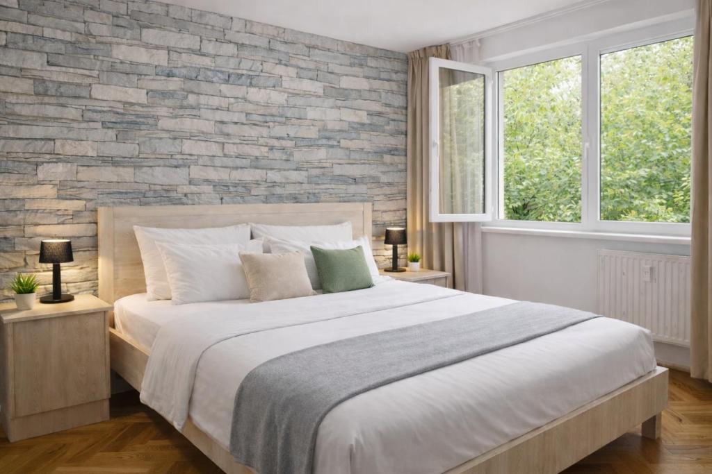 Giường trong phòng chung tại Comfort 14 Stylish City Apartment