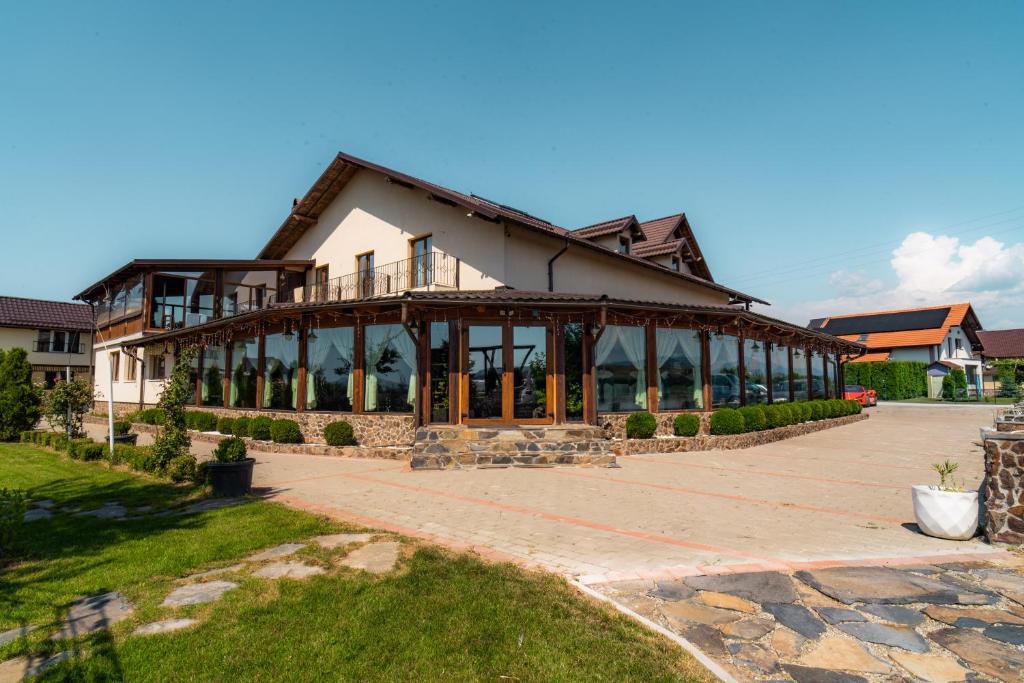 a large building with a lot of windows at Hanul Mariei in Livezile