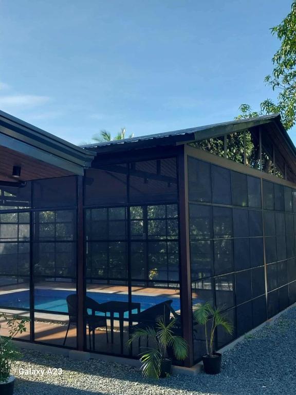 a pavilion with a pool and a table at Sehaliah Agricultural Farm Resort in Amadeo