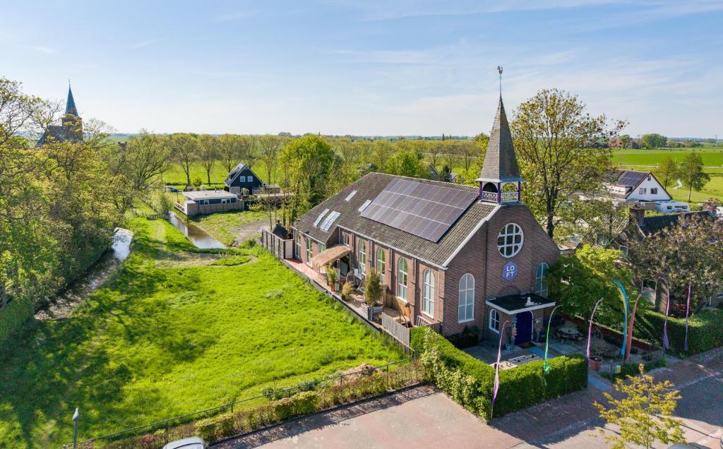 an overhead view of a church with a green roof at LOFT Groepsaccommodatie in Boksum