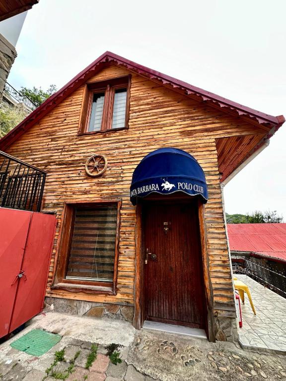 a wooden house with a sign over the door at Isgobya Sumela Monastery 104 in Macka