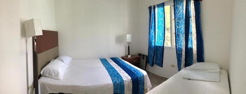 Een bed of bedden in een kamer bij Casa de Diamantes