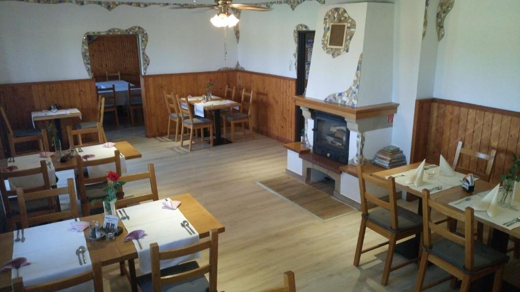 A restaurant or other place to eat at Penzion Conti