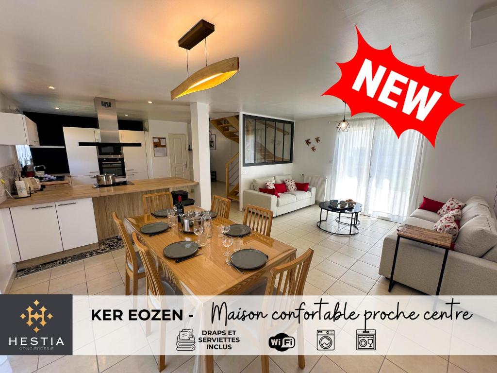 een keuken en een woonkamer met een eettafel en meubels bij KER EOZEN - Maison confortable en plein centre in Plouguerneau
