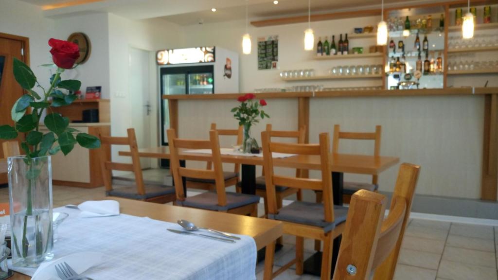 A restaurant or other place to eat at Penzion Conti