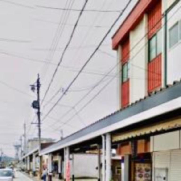 a building on the side of a street at オイソ in Iiyama